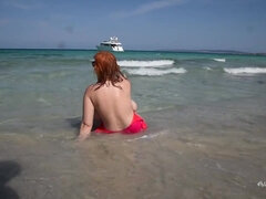 Curvy fat ass redhead mature mom teasing topless on the beach - public