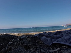 Swimming on the nude beach of Santorini, Greece