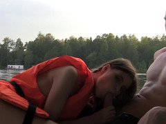 Yummy temptress is giving a blow job on the boat to a dude