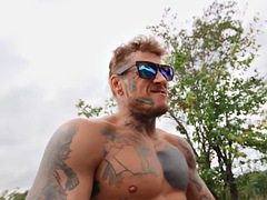 Tattooed gay stud after blowjob and fucking his boyfriend in the ass outdoors
