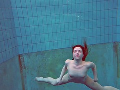 The pretty young Polish girl Alice swimming without clothes