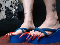 Extreme long long red toenails