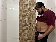 Squirting cum, bearded man with a cap alone in the bathroom having fun in the handjob until he cums a lot - Rodrik Dick