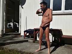 Handjob while sunbathing