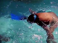 Hot brunette slut Candy swims underwater