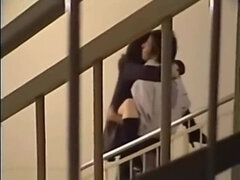 Couples flirting inside of a building