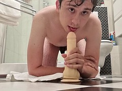 Guy deep throats a dildo fresh out of the shower