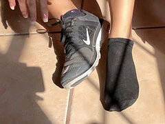 sweat-soaked dark-hued Socks Removal Sweaty soles Close Up