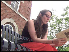 Renee flashes her feet while reading a book to you!