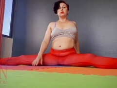 Regina Noir practices yoga in the gym wearing a seductive red yoga leotard