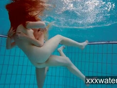Milana and Katrin strip eachother underwater