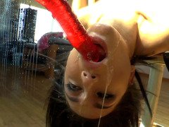 Hot bitch opens up her mouth to suck a sex toy in front of mirror