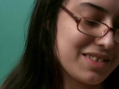 Solo girl in glasses playing with her hairy pussy