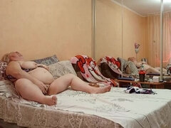 Hot MILF Zona901 rubs her big natural tits and fingers her meaty pussy in the evening