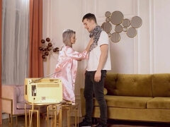 Attractive GILF is having sex with a young slender fella