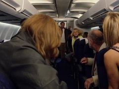 Pilot and a couple of sexy flight attendants fuck on the plane