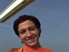 German slut with small tits loves to fuck her cunt with a dildo on a ferris wheel