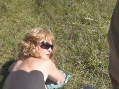 Stunning blonde caught naked on a wild beach gets a surprise cumshot from a pervy voyeur