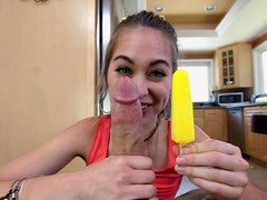 Playful chick with a smile on her face eats an ice cream and semen