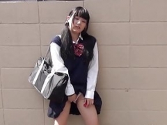 Tiny Japanese schoolgirl toys pussy over panties in public