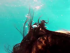 Amelie Bruna is an appetizing brunette with big boobs in the pool