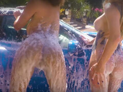 Ebony MILF and her naked GFs wash a car