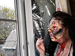 Wife smokes a cigarette makeup zombie