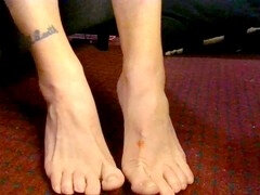 Abby Anna shows off her gorgeous feet with some natural toe wiggling under the desk