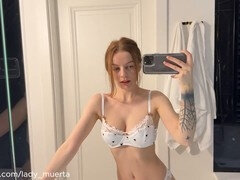 Timid redhead Cassie Kelly does a slow and sensual striptease in the bathroom