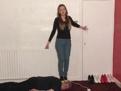 High-Heeled Babe Dances and Tramples Slave's Head Fetish