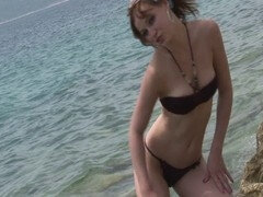 Emily Diamond uses tight latex gloves to pleasure her natural pussy to the extreme