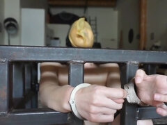 Elise Graves handcuffs herself and masturbates in a cage