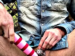 Interrupted outdoor cumshot in chastity cage