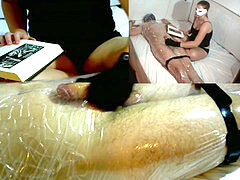 female dom handjob tease in Plastic Wrap While Reading