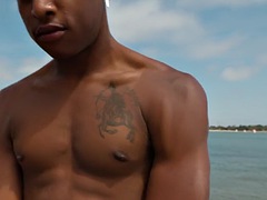 Handsome man with white tattoos without a condom fucks his bottom boyfriends black ass