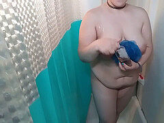 shaven dame in the douche after headshave