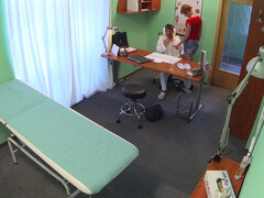 Redhead receives a full pussy exam by doc