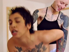 Tattooed amateur lesbians in sensual vaginal sex with strapon