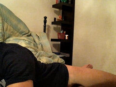 Latino boy Alexio Duran pulls off his shorts and strokes that big cock, rolling around on his bed.
