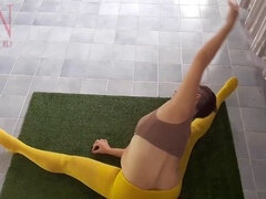 Regina Noir practices yoga in a gym wearing yellow tights and no panties, caught on webcam