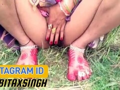 Indian Bhabhi enjoys outdoor pee session in an open field