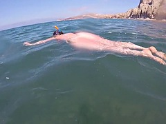 Swimming on the nude beach of Santorini, Greece