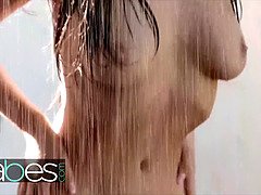 Two big tit wet lesbians rub their teen pussies in the rain