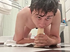 Guy deep throats a dildo fresh out of the shower