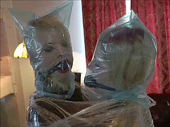 2 ladies wrapped In Plastic