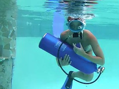 Hungarian beauty fucks a dildo underwater