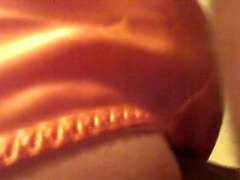 Orange satin g-string nail doggy style