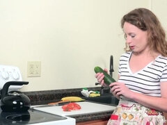 Ana Molly masturbates with vegetables in kitchen