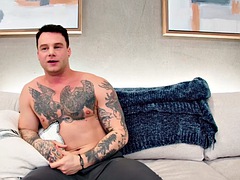 Tattooed solo jock jerking off his cock really hard and fast at casting