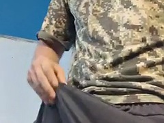 Horny army soldier plays with his huge bulge and masturbates